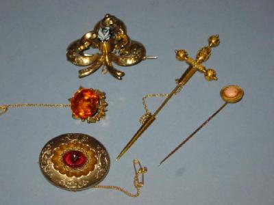 Appraisal: A GOLD DAGGER PIN with applied beading and ropework to