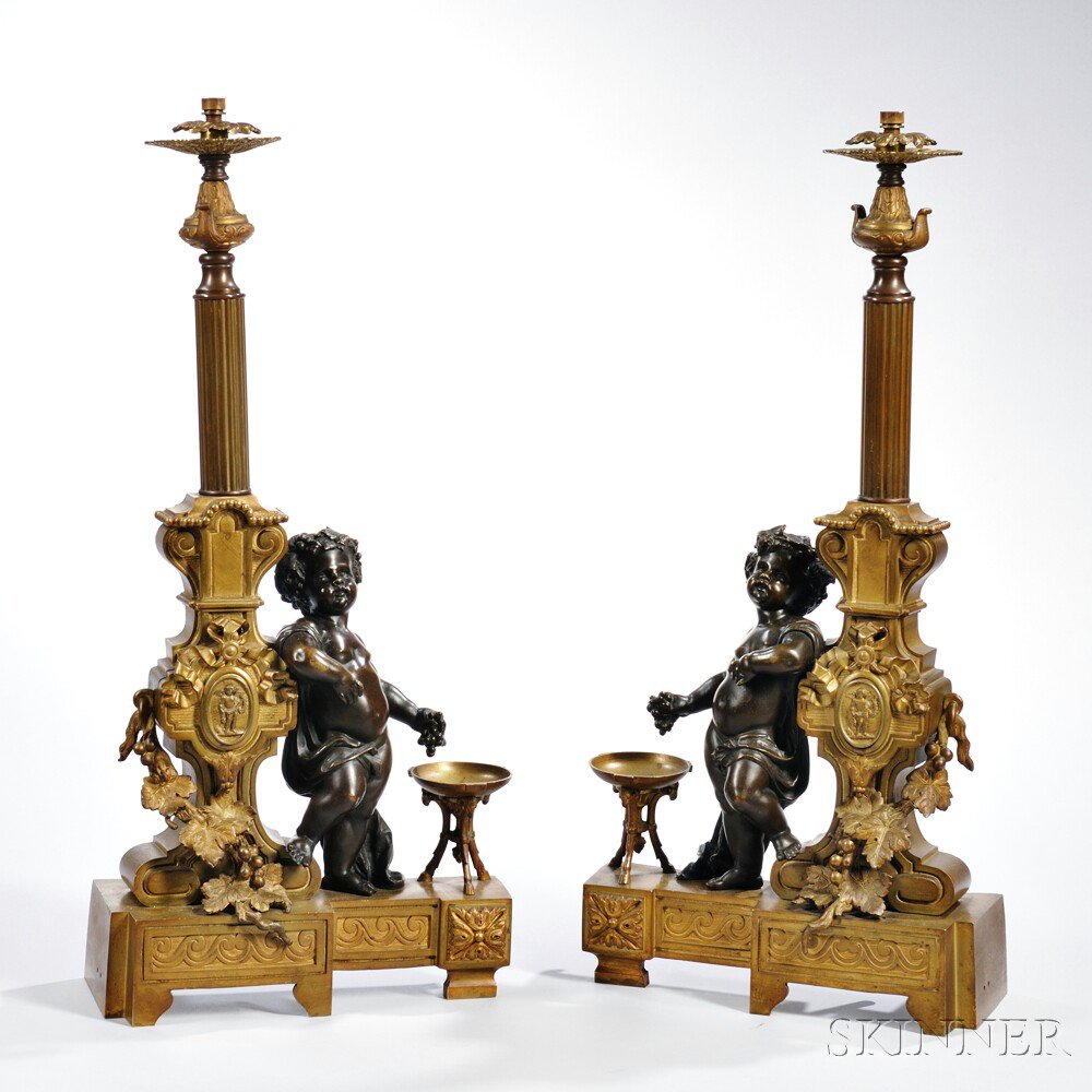 Appraisal: Pair of Louis XVI-style Bronze Cupid Chenet probably France th