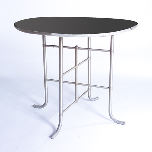 Appraisal: WARREN McARTHUR Table with circular black top on tubular aluminum