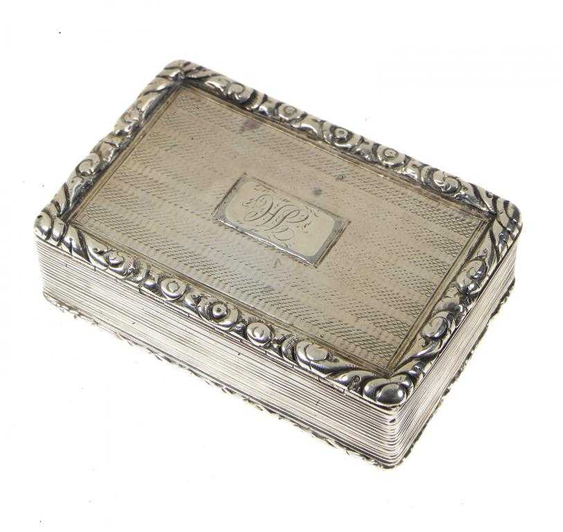 Appraisal: A GEORGE IV SILVER SNUFF BOX with foliate chased rims