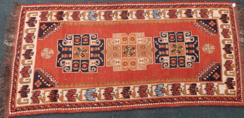 Appraisal: A Persian type runner with a design of medallions on