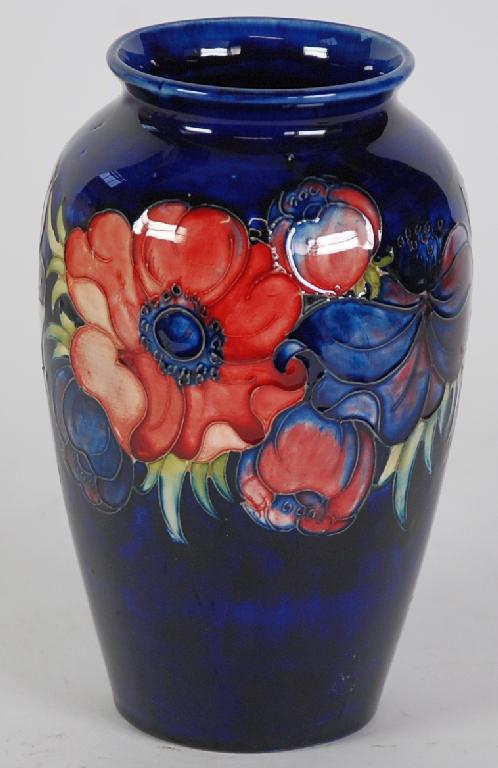 Appraisal: WALTER MOORCROFT POTTERY OVIFORM VASE decorated with flowers on a