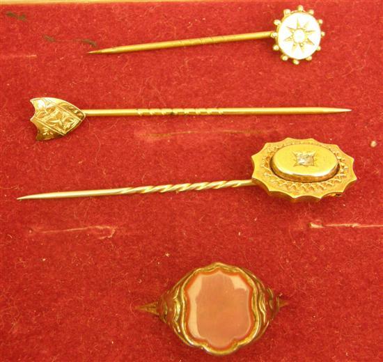 Appraisal: Two Victorian gold stick pins and a gold hardstone set