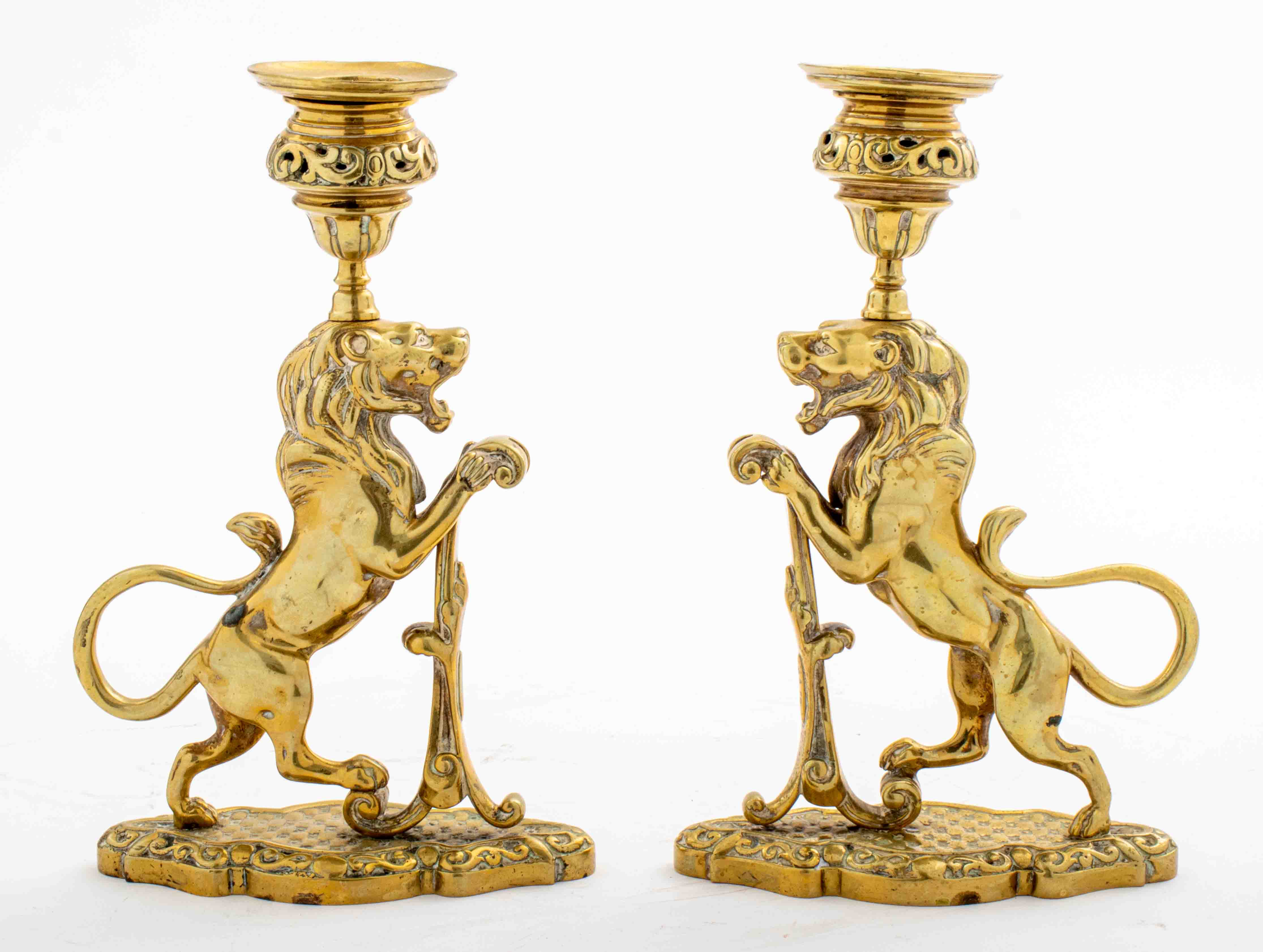 Appraisal: BRASS CLASSICAL LION CANDLESTICKS PAIR Pair of brass classical lion