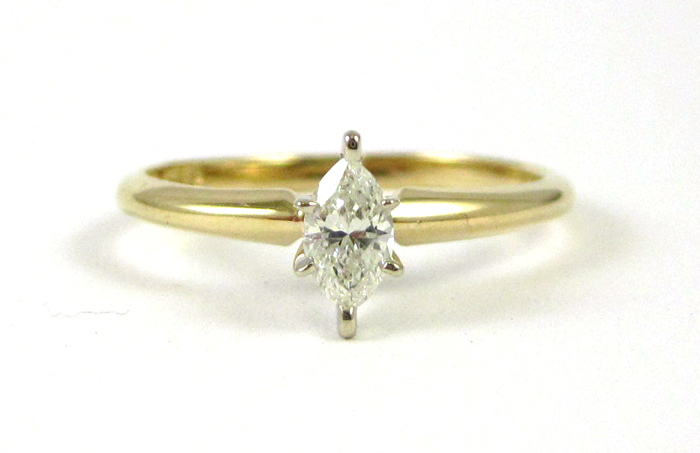 Appraisal: DIAMOND AND FOURTEEN KARAT GOLD SOLITAIRE RING The yellow and