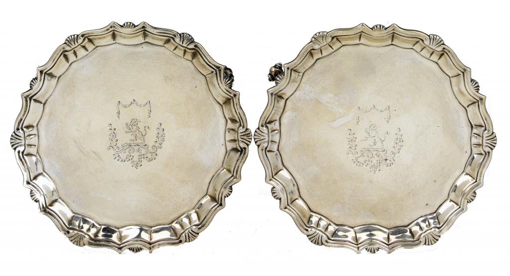 Appraisal: A PAIR OF GEORGE II WAITERS the moulded rim with