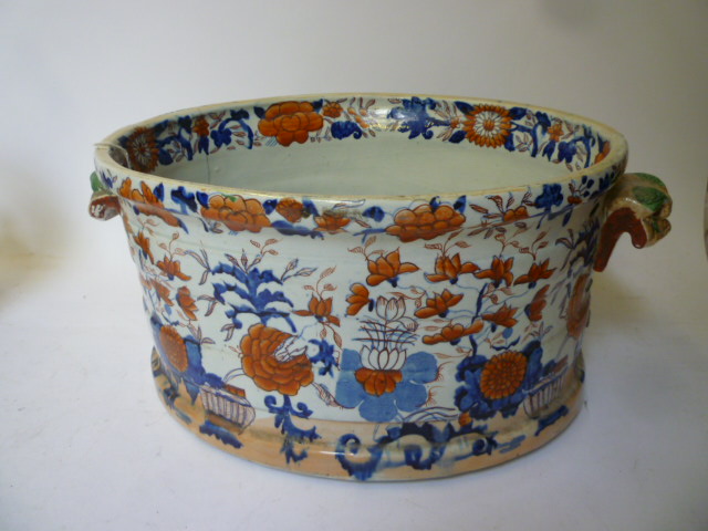 Appraisal: AN IRONSTONE FOOTBATH mid th century of stave moulded oval