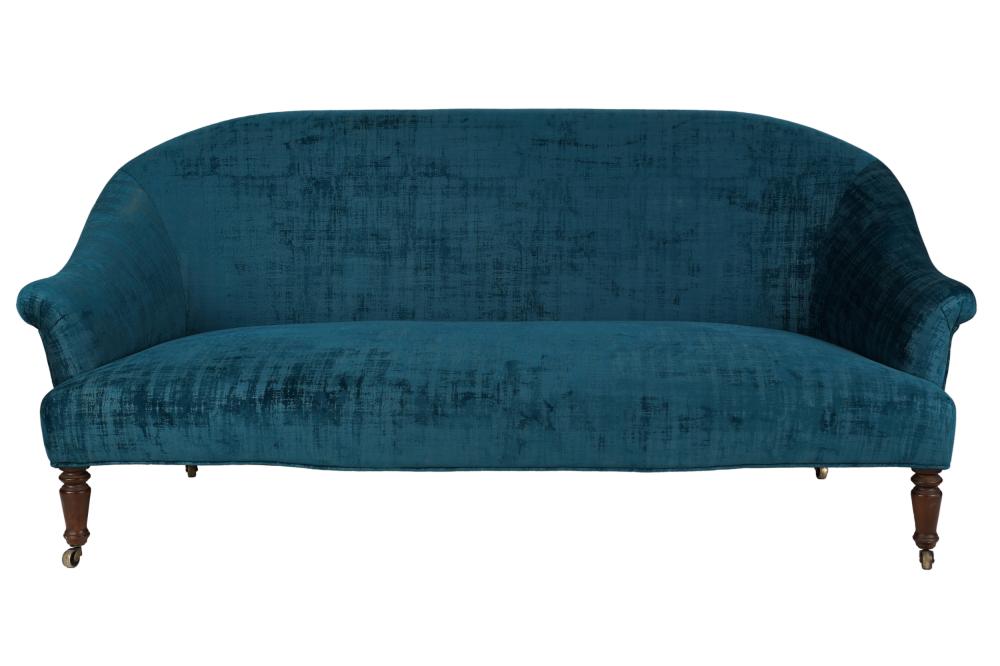 Appraisal: BLUE UPHOLSTERED SOFAwith wooden legs on castors Condition slight rubbing