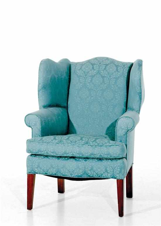 Appraisal: Hepplewhite style mahogany wingback armchair domed back flanked by shaped