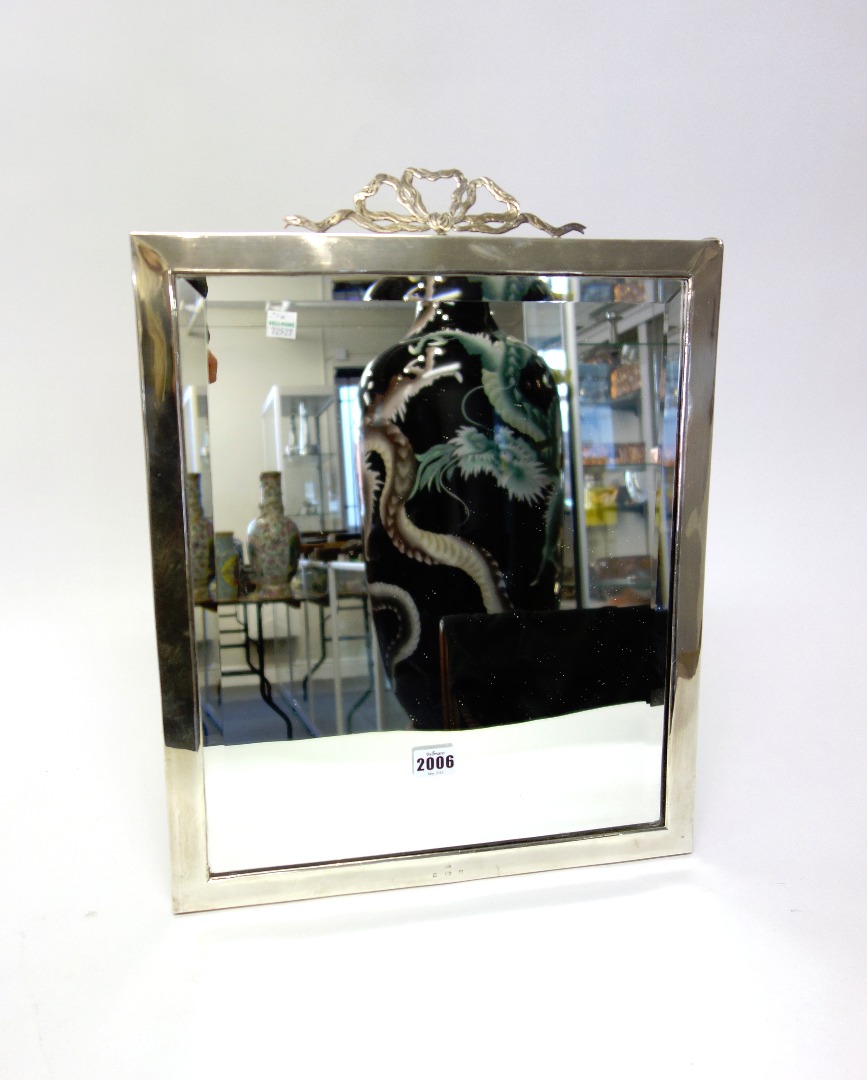 Appraisal: A silver framed large rectangular strut backed mirror the top