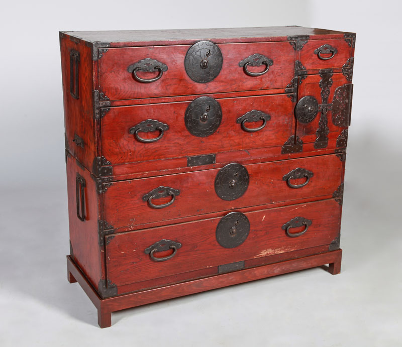 Appraisal: JAPANESE METAL-MOUNTED STAINED PINE TANSU Fitted with one lockable door