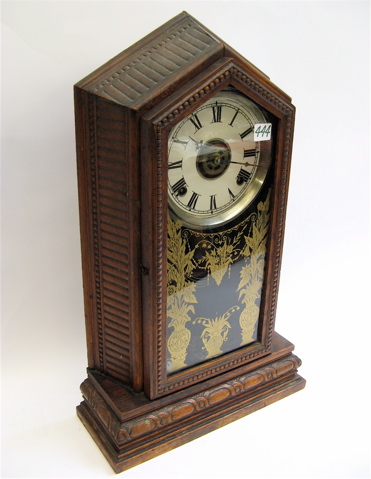 Appraisal: GILBERT BROS CARVED OAK SHELF CLOCK time and strike on