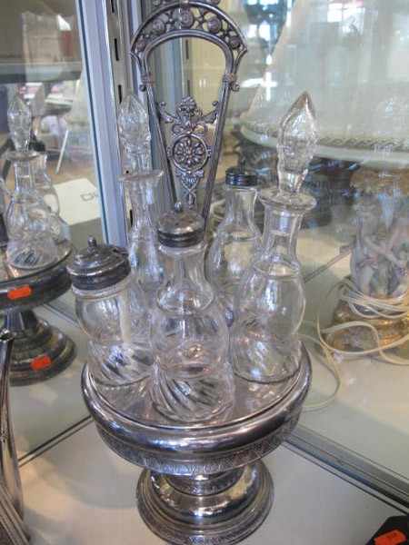 Appraisal: FIVE BOTTLE SILVER PLATE AND GLASS CRUET SET