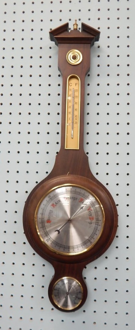 Appraisal: A modern mahogany finish two dial barometer the cm dia