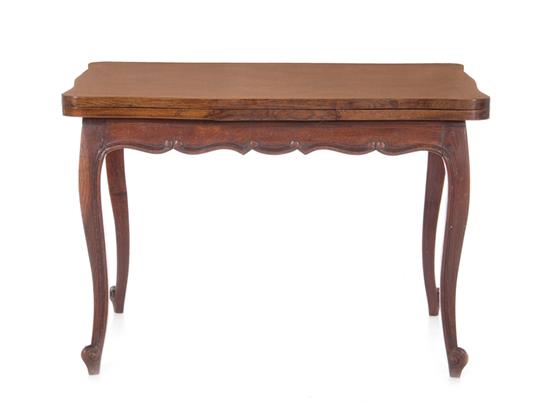 Appraisal: French Provincial oak parquetry-inlaid draw leaf table circa serpentine top