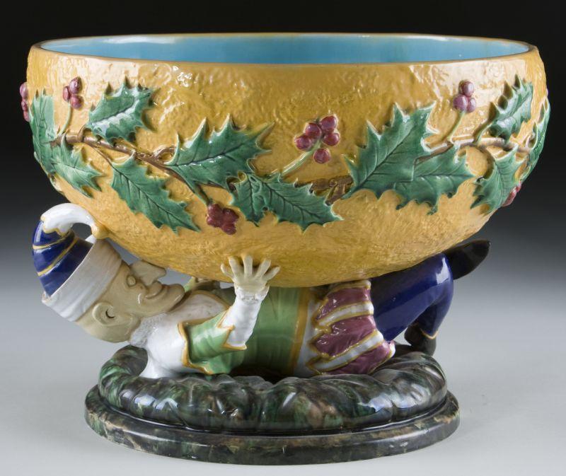 Appraisal: George Jones Majolica Punch Bowl featuring a recumbent Punch of