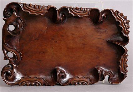 Appraisal: CHINESE CARVED HARDWOOD TRAY The oblong surface with raised inverted