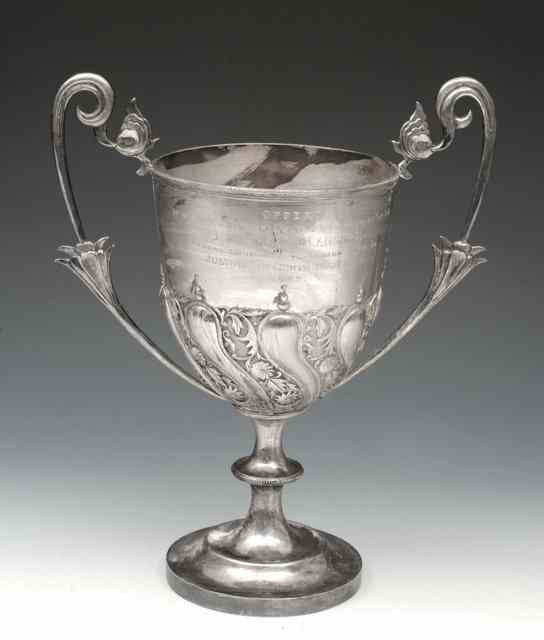 Appraisal: A CHINESE SILVER TROPHY CUP with chased foliate decoration inscribed