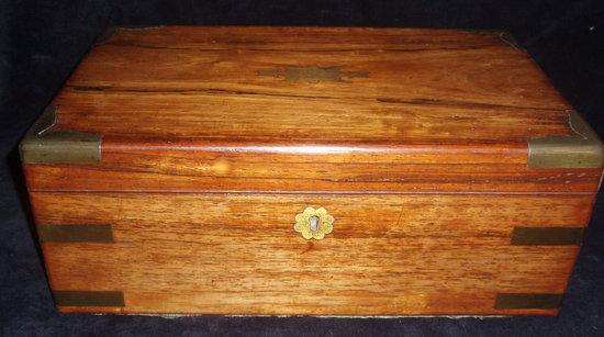 Appraisal: An early Victorian rosewood writing box brass bound and fitted