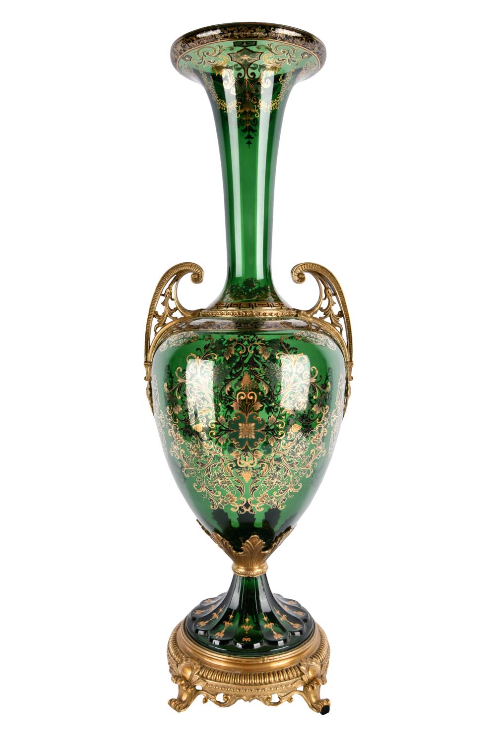 Appraisal: GREEN GLASS URNwith bronze base and handles painted enamel decoration