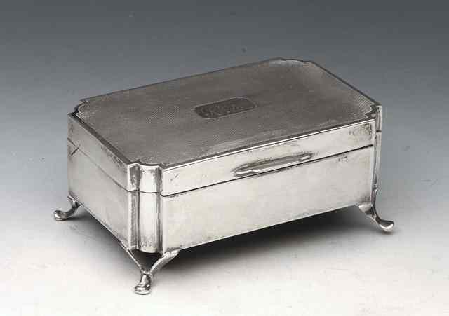 Appraisal: A SILVER TRINKET BOX rectangular with canted corners and engine