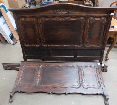 Appraisal: Dark oak continental paneled sleigh double bed