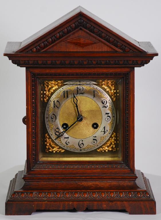 Appraisal: EARLY TWENTIETH CENTURY OAK MANTEL CLOCK by Junghans the silvered