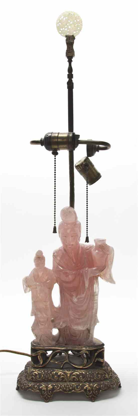 Appraisal: A Chinese Rose Quartz Carving of a Woman depicted holding