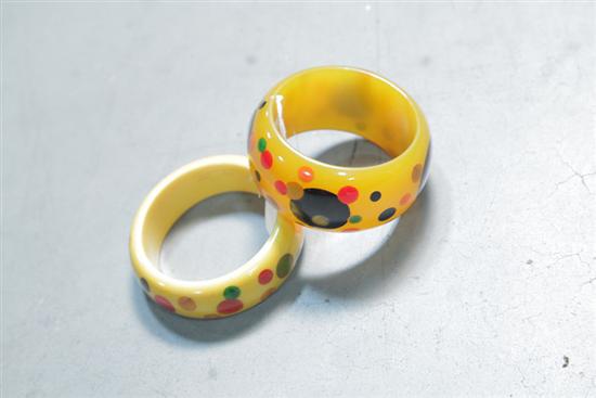 Appraisal: TWO BAKELITE BRACELETS Both yellow with inlaid multi-color polka-dots ''w