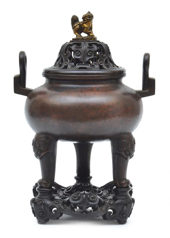 Appraisal: A QING DYNASTY BRONZE CENSER WITH CARVED WOODEN BASE TH