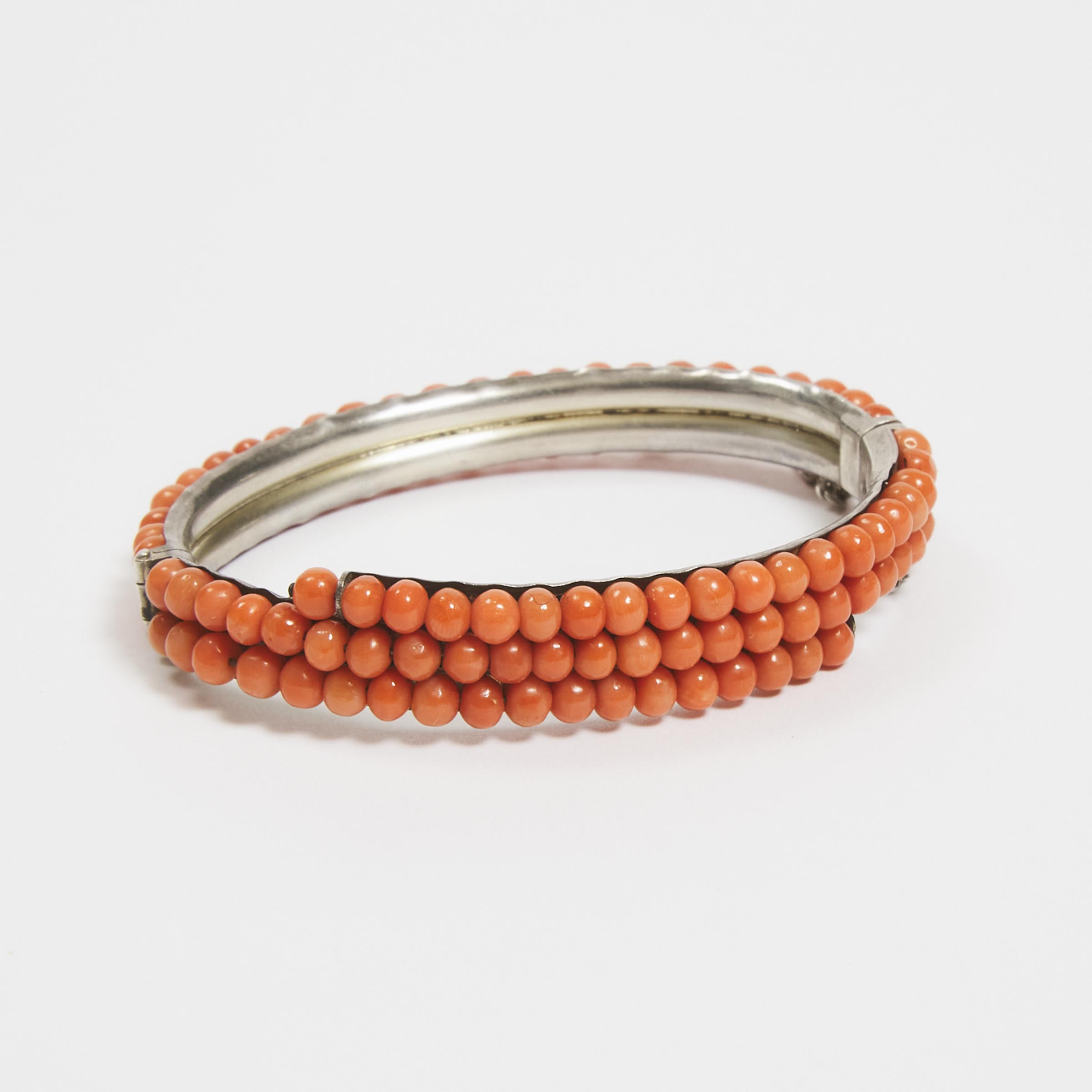 Appraisal: A Silver Mounted Coral Bangle diameter in cm