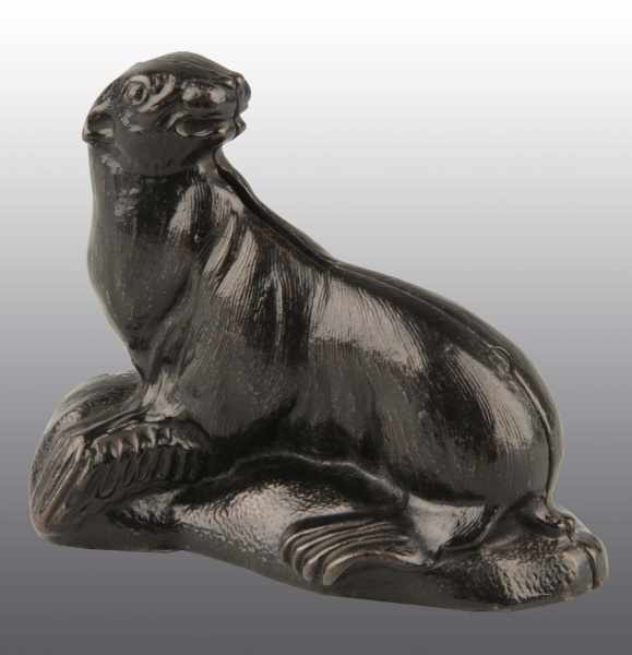 Appraisal: Cast Iron Sea Lion on Rock Still Bank Description Manufactured