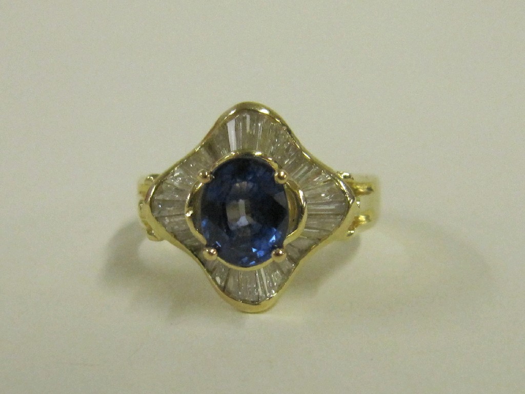 Appraisal: Eighteen carat gold sapphire and diamond cluster ring with central