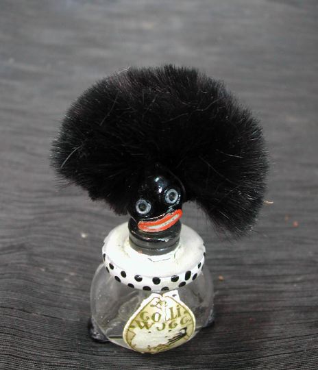 Appraisal: Rare Vigny France Gollywogg Glass Perfume Bottle the stopper modeled