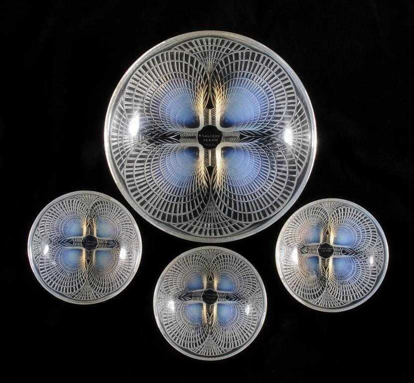 Appraisal: COQUILLES FOUR LALIQUE OPALESCENT GLASS BOWLS moulded with scallop shells