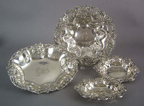 Appraisal: Four sterling silver serving dishes with floral decorated borders two