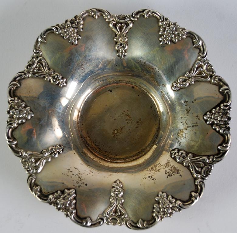 Appraisal: STERLING SILVER PETAL SHAPED DISH with floral and scroll embossed