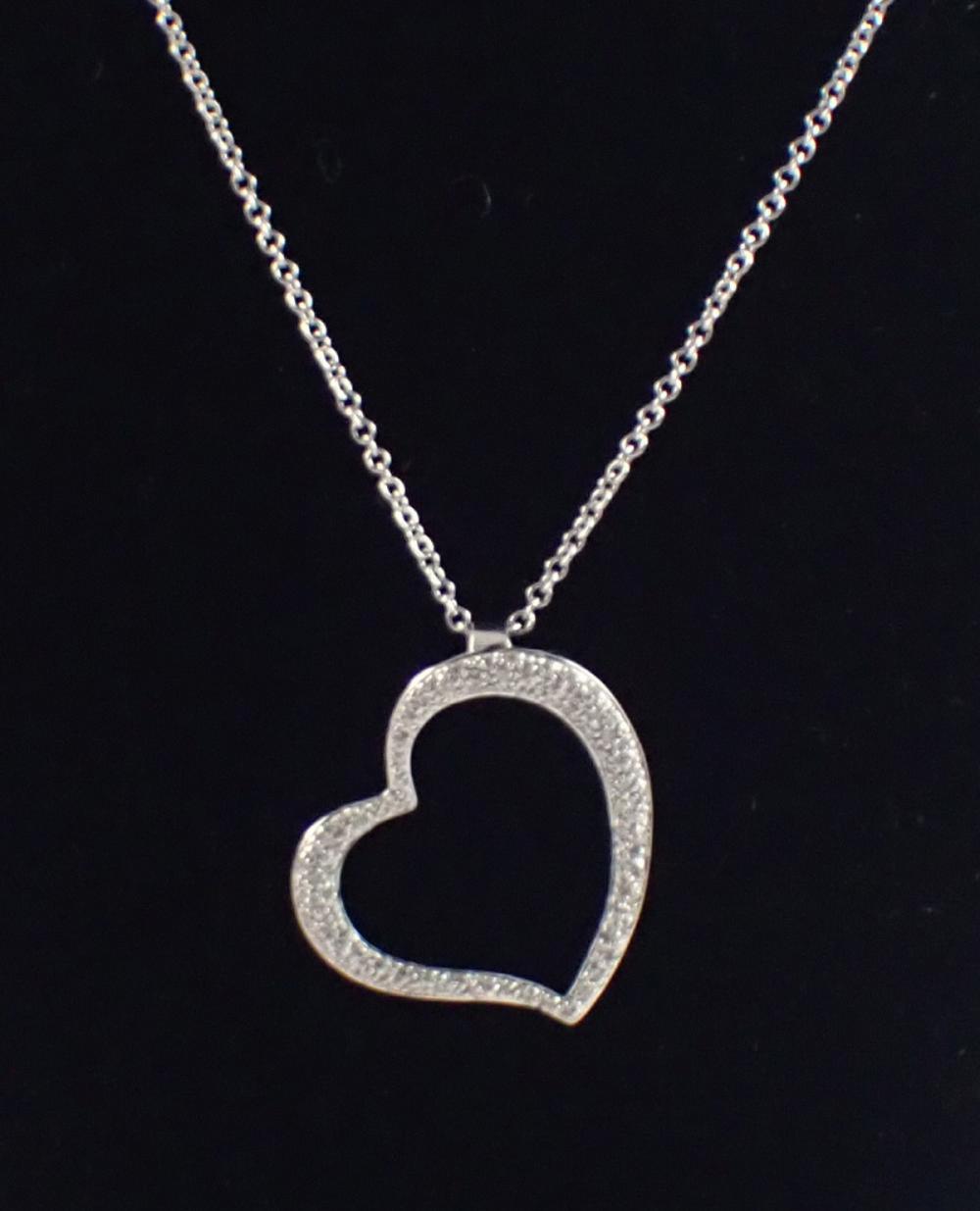 Appraisal: DIAMOND AND FOURTEEN KARAT WHITE GOLD PENDANT NECKLACE with a