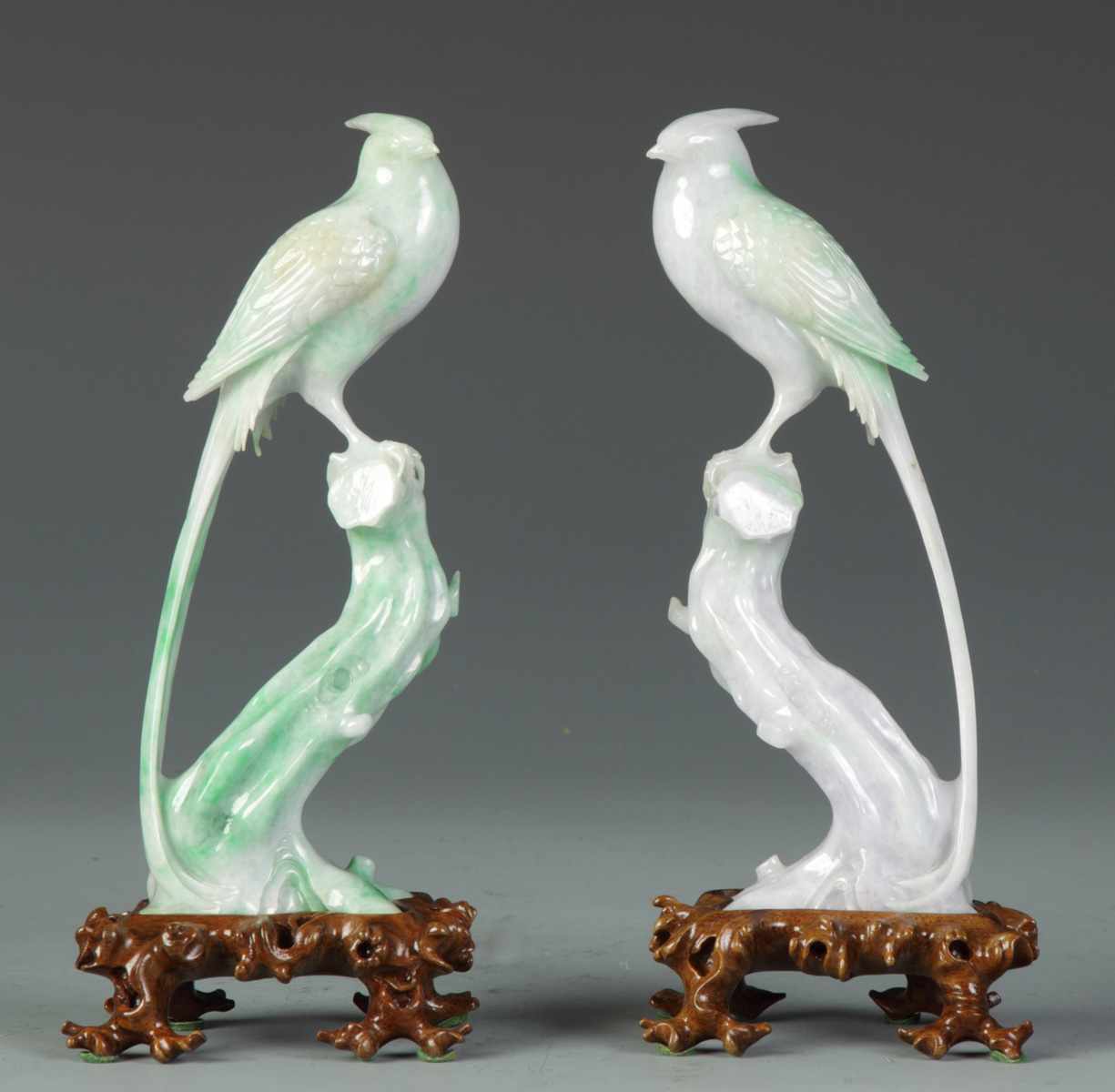 Appraisal: Pair of Finely Carved Jade Birds on Stumps Pair of