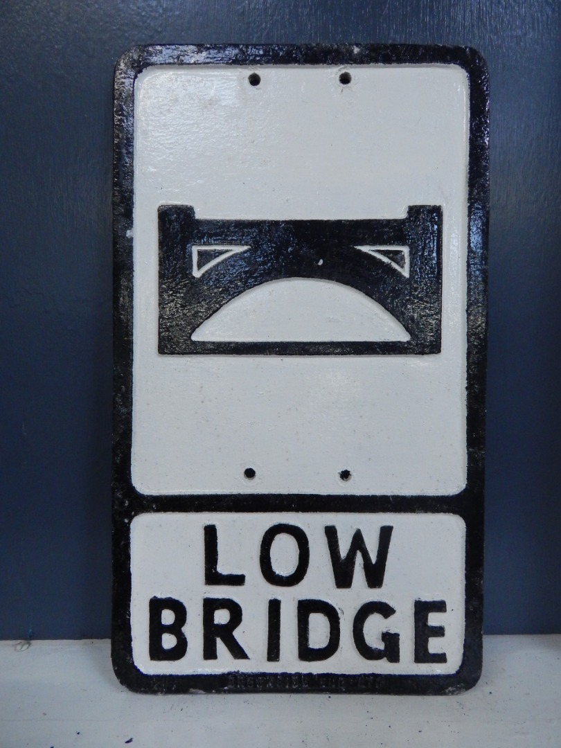 Appraisal: A cast aluminium Low Bridge road sign marked Brookside England