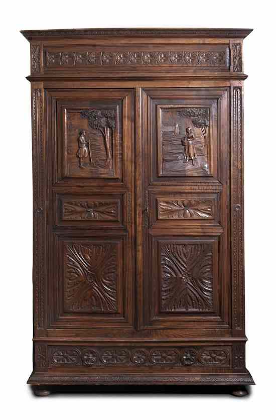 Appraisal: An English Oak Armoire having a stepped cornice above the