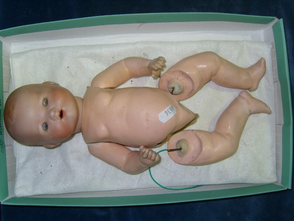 Appraisal: An Armand Marseille bisque headed baby doll with impressed mark