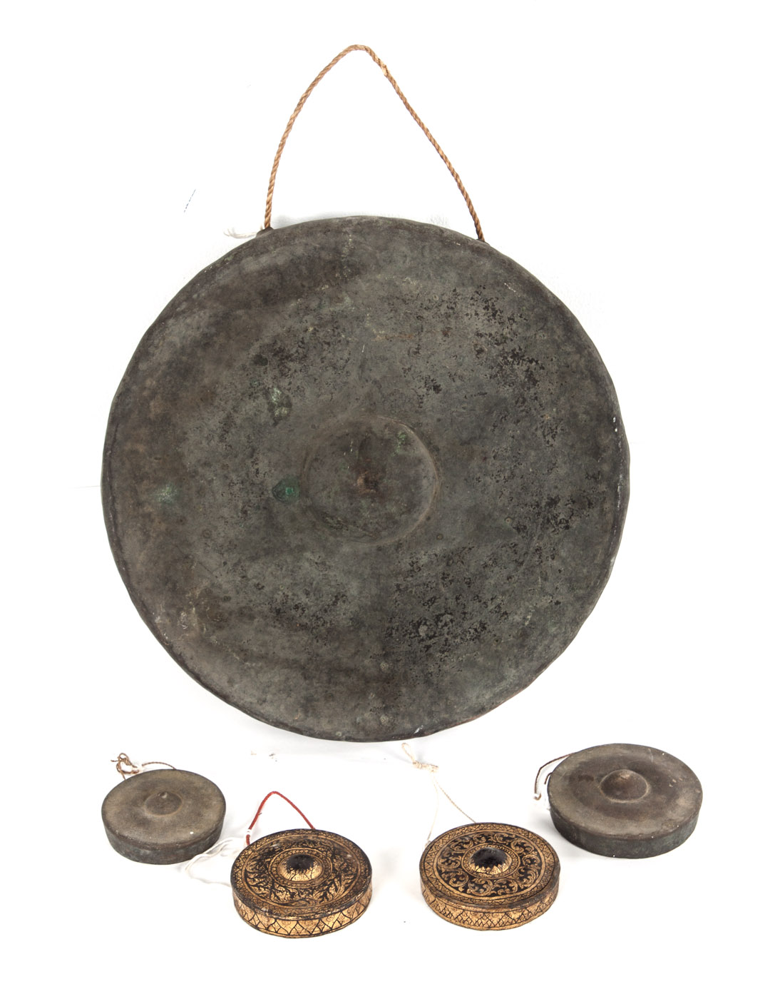 Appraisal: a Five Chinese and Southeast Asian gongs comprising a large