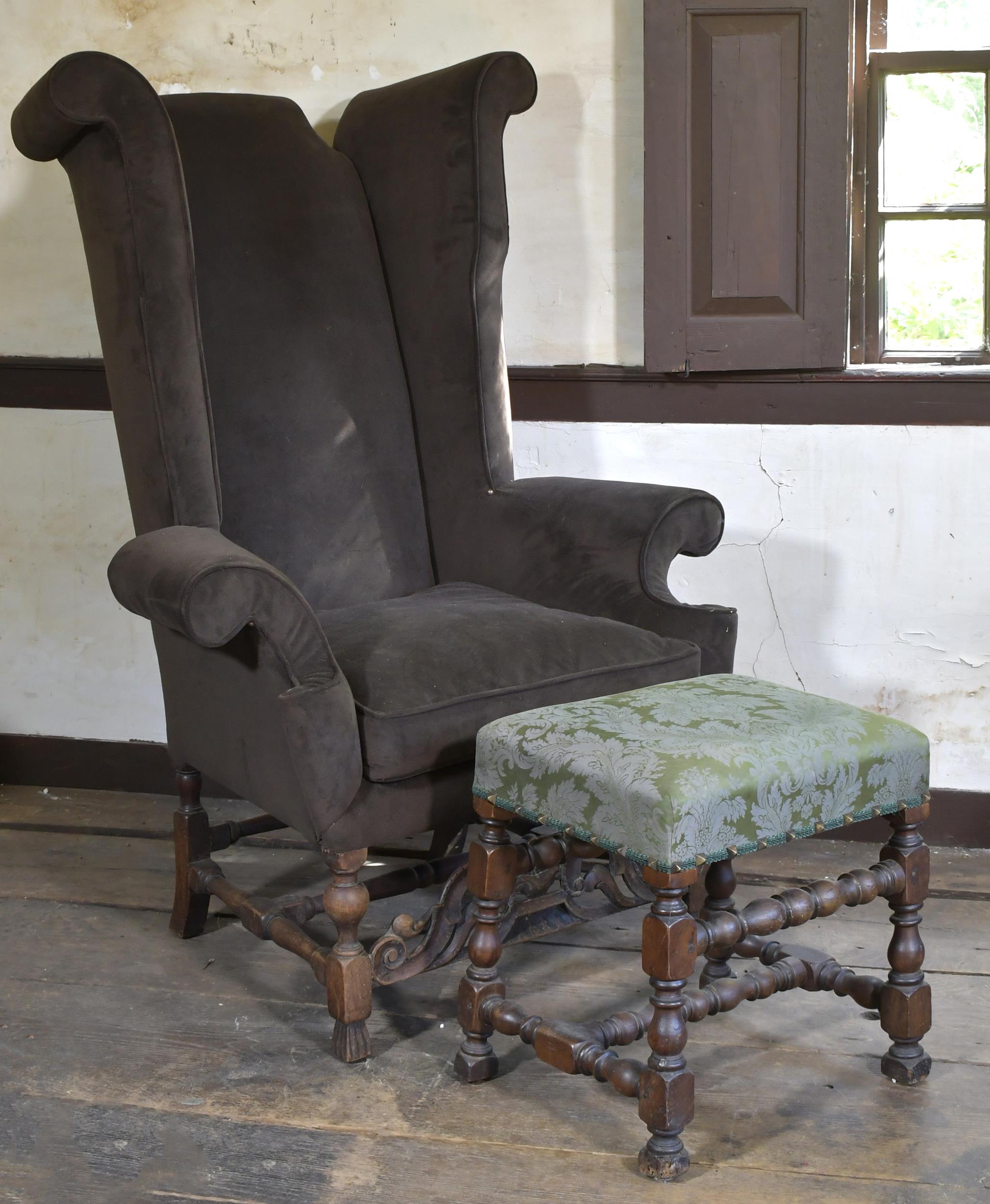 Appraisal: ANTIQUE WING CHAIR AND OTTOMAN An antique English high backed