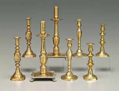 Appraisal: Four pairs brass candlesticks one pair with square bases and