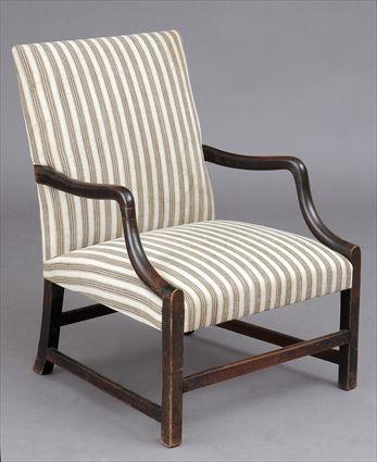 Appraisal: GEORGE III MAHOGANY LIBRARY ARMCHAIR The raked rectangular backrest flanked