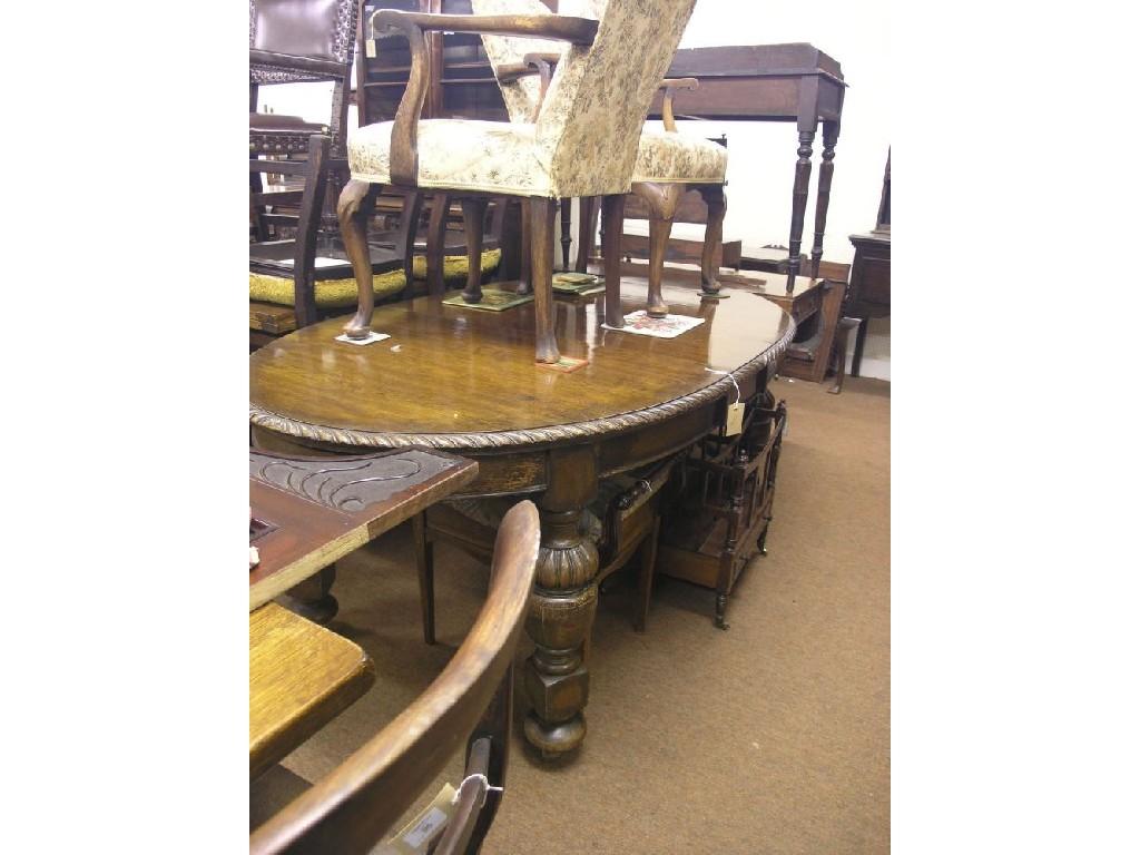 Appraisal: An early th century oak wind-action draw-leaf dining table oval