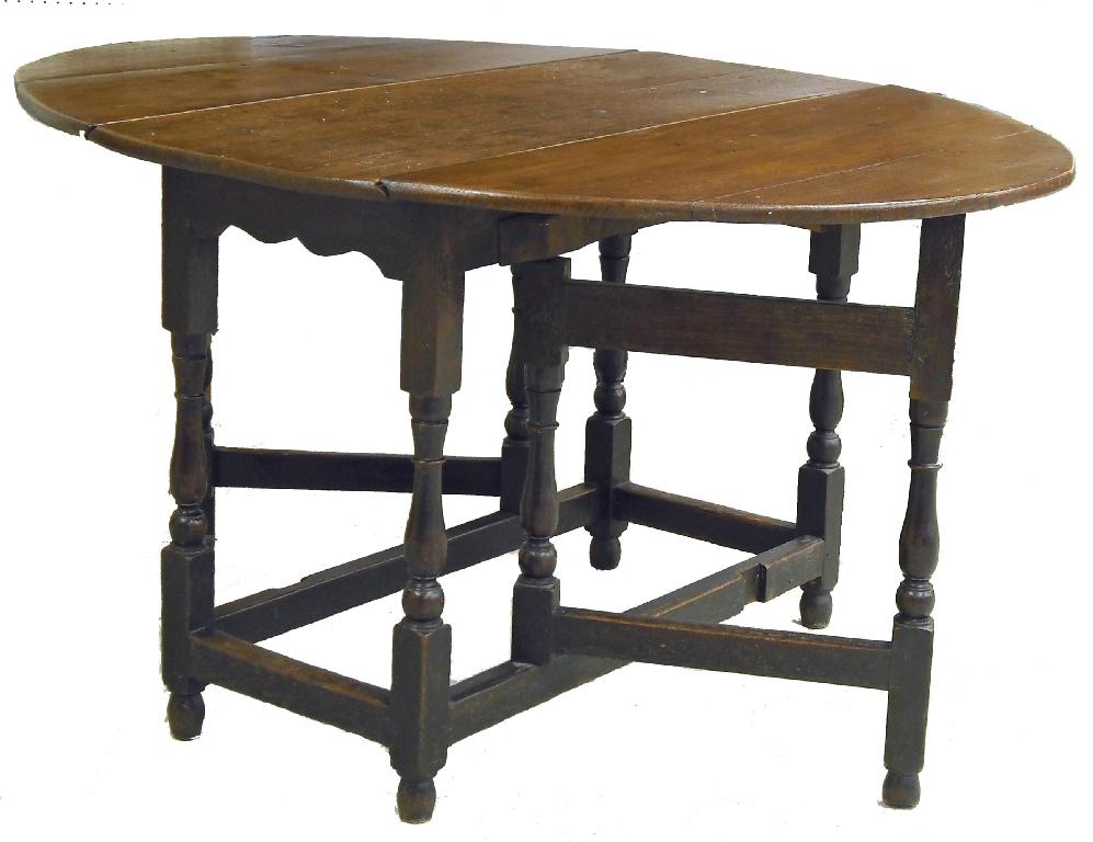 Appraisal: th century oak oval gateleg dining table upon turned supports