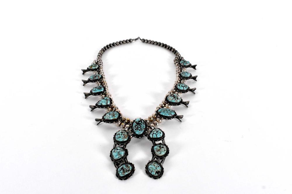 Appraisal: NAVAJO TURQUOISE SILVER SQUASH BLOSSOM NECKLACEUnmarked The silver beaded strand