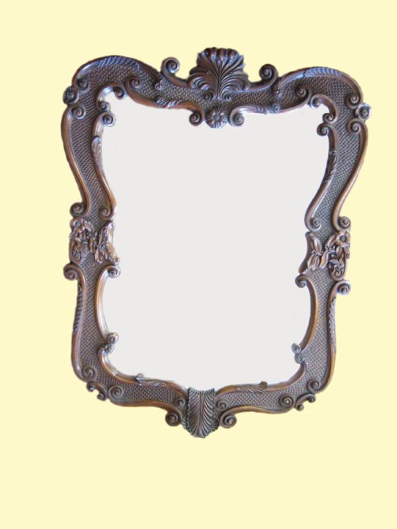 Appraisal: A Victorian massive oak framed Mirror with scallop and scroll